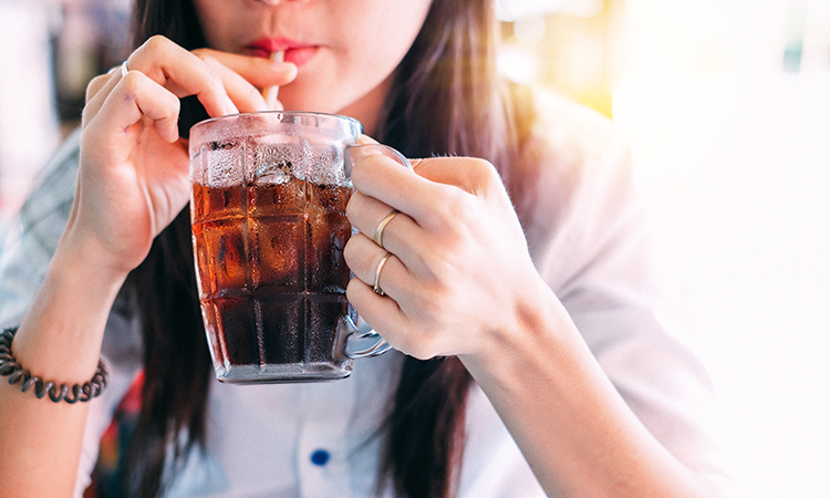 woman drinking cola